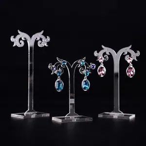 Vue détaillée du support d'affichage de boucles d'oreilles, présentoir de bijoux transparent.