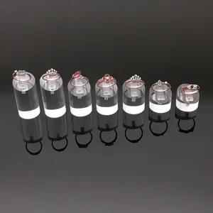 Set of minimalist rose gold fashion rings with various cute charms on acrylic stands.