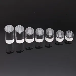 Acrylic ring display stand detail showing clear cylindrical holders in various heights.
