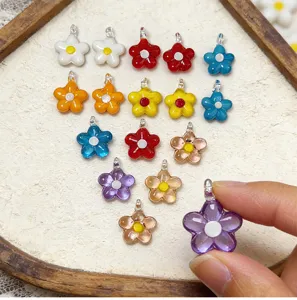 Colorful glass flower pendants, mini five-petal flower charms, DIY jewelry making detail.
