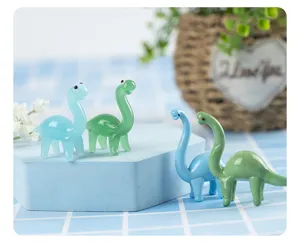 Close-up of cute colorful glass dinosaur figurines, perfect for creative desk and home decor.