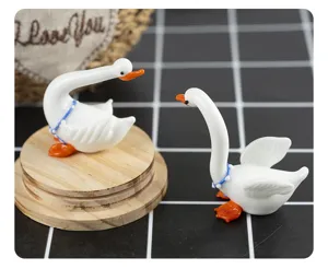 Handmade miniature glass white swan figurine, cute desktop and car decorative ornament detail.
