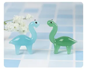 Charming detailed close-up of cute colorful glass dinosaur figurines for lovely desktop display decor.
