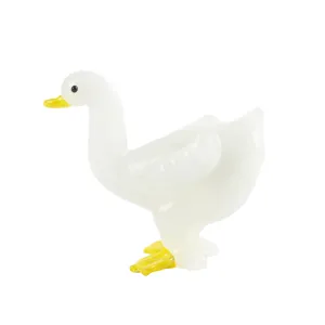 Cute white glass duck figurine, perfect tabletop ornament for home decor and living room display.
