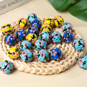 Handmade glass floral beads, colorful lampwork round perforated charms for DIY jewelry making.