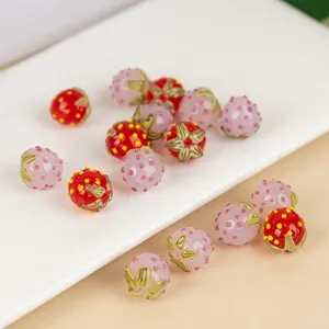 Handmade strawberry lampwork glass beads for DIY charm bracelets and phone chains main view.