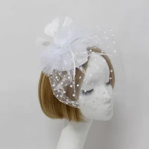 White bridal fascinator with mesh veil and feathers, perfect for weddings, parties, and photo shoots.