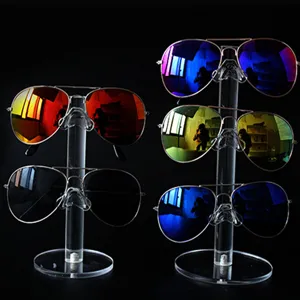 Acrylic sunglasses display stand multi-tier organizer for retail store and eyewear showcase.