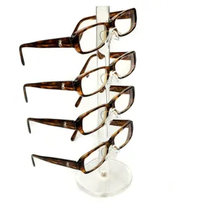 Présentoir de lunettes en acrylique transparent à 4 niveaux avec montures écaille.
