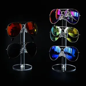Clear acrylic glasses display stand with multi-layer sunglasses holder for retail store use.