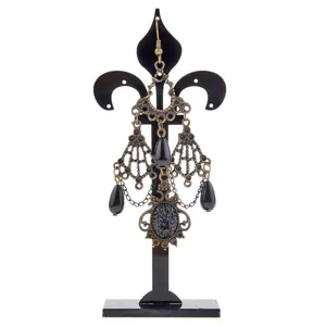 Black acrylic jewelry display stand vintage fleur-de-lis earring holder for retail shop showcase.