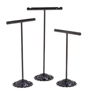 Black metal T-bar earring display stand set of three for retail jewelry counter organization.