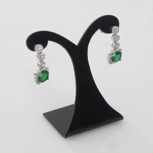 Elegant emerald green oval drop earrings with crystal halo and sparkling studs display