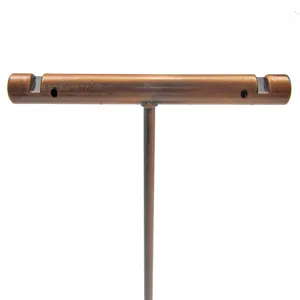 Closeup detail of the bronze metal T-bar earring display stand showing slots and holes for jewelry.