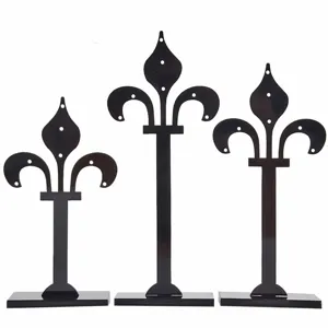 Black acrylic earring display stand detail, multi-hole jewelry holder rack for stud earrings.