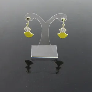 Elegant fan-shaped drop earrings with sparkling rhinestones and vibrant yellow enamel details.