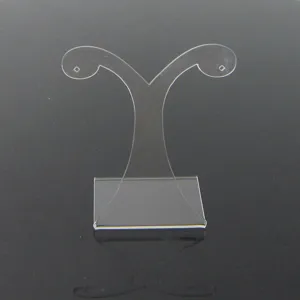 Clear transparent acrylic earring display stand, jewelry holder detail shot for showcase.