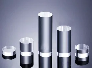 Detailed shot of transparent acrylic cylinder display risers for jewelry and collectibles.