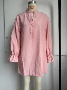 Pink long sleeve blouse with henley collar and ruffle cuffs, relaxed fit casual shirt detail.