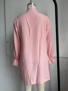 Pink long-sleeve loose casual blouse shirt with delicate ruffle cuffs and mandarin collar.