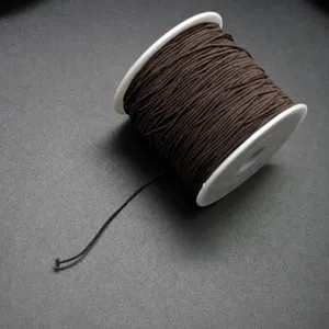 Bruine elastische koordspoel voor DIY kralen en sieraden maken, flexibele draad