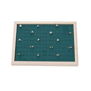Detailed view of the velvet ring display tray with slots, showing neat jewelry organization.