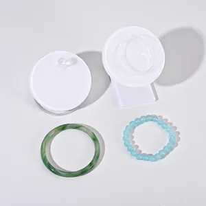 Acrylic bracelet display stand with white storage box and bangle props for jewelry presentation detail.