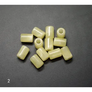 Close-up detail of acrylic barrel beads, bulk amber-style spacer beads for DIY jewelry making.