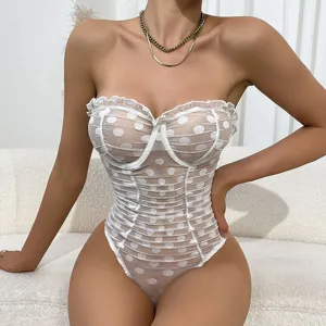 Close-up detail of sheer mesh polka dot bodysuit with ruffle underwire design, elegant top.