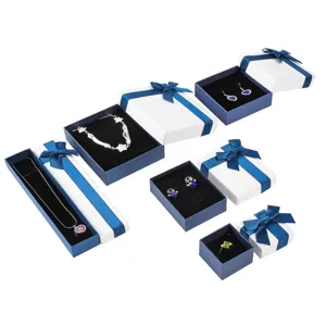 Assorted blue and white jewelry gift boxes set with ribbon bow for necklace ring earrings detail.