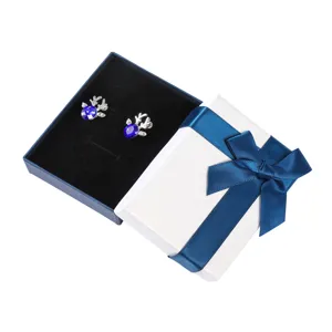 Detailed view of elegant blue crystal deer stud earrings presented in a luxury gift box.