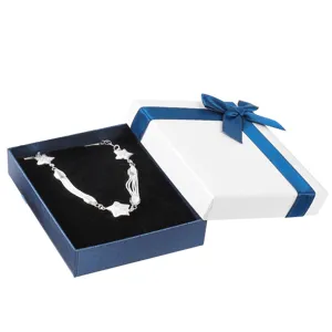 Detailed close-up of the silver star necklace displayed inside an elegant gift box.