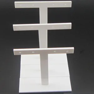 Support de présentation de boucles d'oreilles en acrylique blanc à 3 niveaux.