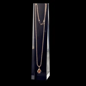Transparent acrylic necklace display stand featuring elegant flower pendant chain.