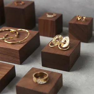 Walnut wood jewelry display blocks square photography props for rings and bracelets showcase.