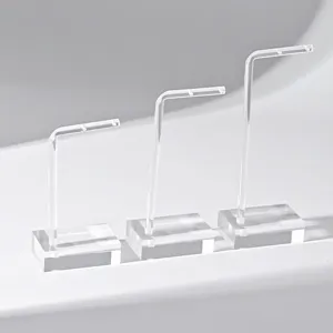 Support de présentation de boucles d'oreilles en acrylique transparent et élégant.