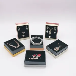 Fashion jewelry set gift box display featuring necklaces, earrings, rings, and bracelets.