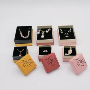 Fashion jewelry gift boxes set featuring necklaces, rings, and earrings in neat display.