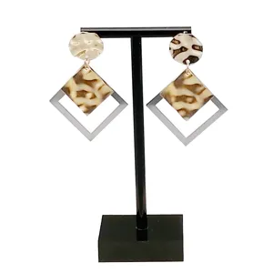 Black acrylic T-shaped earring display stand for jewelry retail counter and photo props.