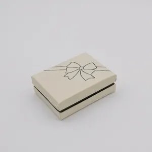 Elegant off-white gift box with bow design for jewelry, necklace, ring packaging and display.