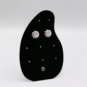 Support de présentation de boucles d'oreilles en acrylique noir pour photographie de bijoux.