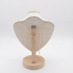 Gold metal chain necklace with extension for women elegant jewelry accessory detail shot