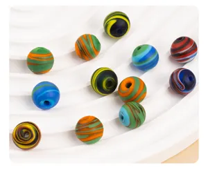 Frosted colorful swirled glass loose beads detail shot, perfect for DIY handmade jewelry crafts.