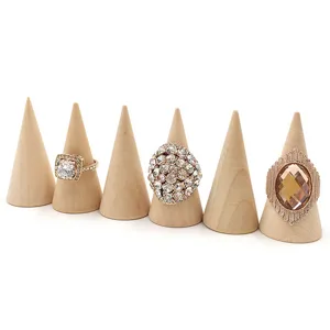 Wooden cone ring display stands featuring assorted sparkling fashion crystal rings.
