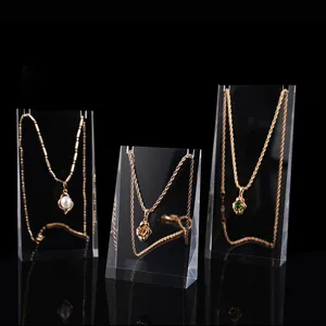 Clear acrylic necklace display stands detail view, transparent jewelry organizer props for retail.
