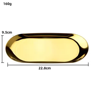 Détail du plateau à bijoux ovale en acier inoxydable doré, surface métallique et taille.