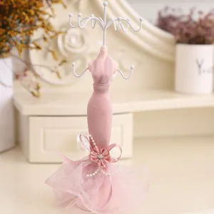 Pink mannequin jewelry display stand detail, elegant necklace and earring holder for dressing table.