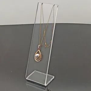 Soporte de exhibición de collar de acrílico transparente con colgante de perla.