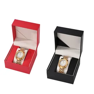 Detailed view of luxury PU leather watch gift boxes featuring elegant gold quartz watches inside.
