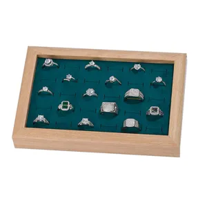 Solid wood jewelry display tray with green velvet insert for rings, earrings and accessories.